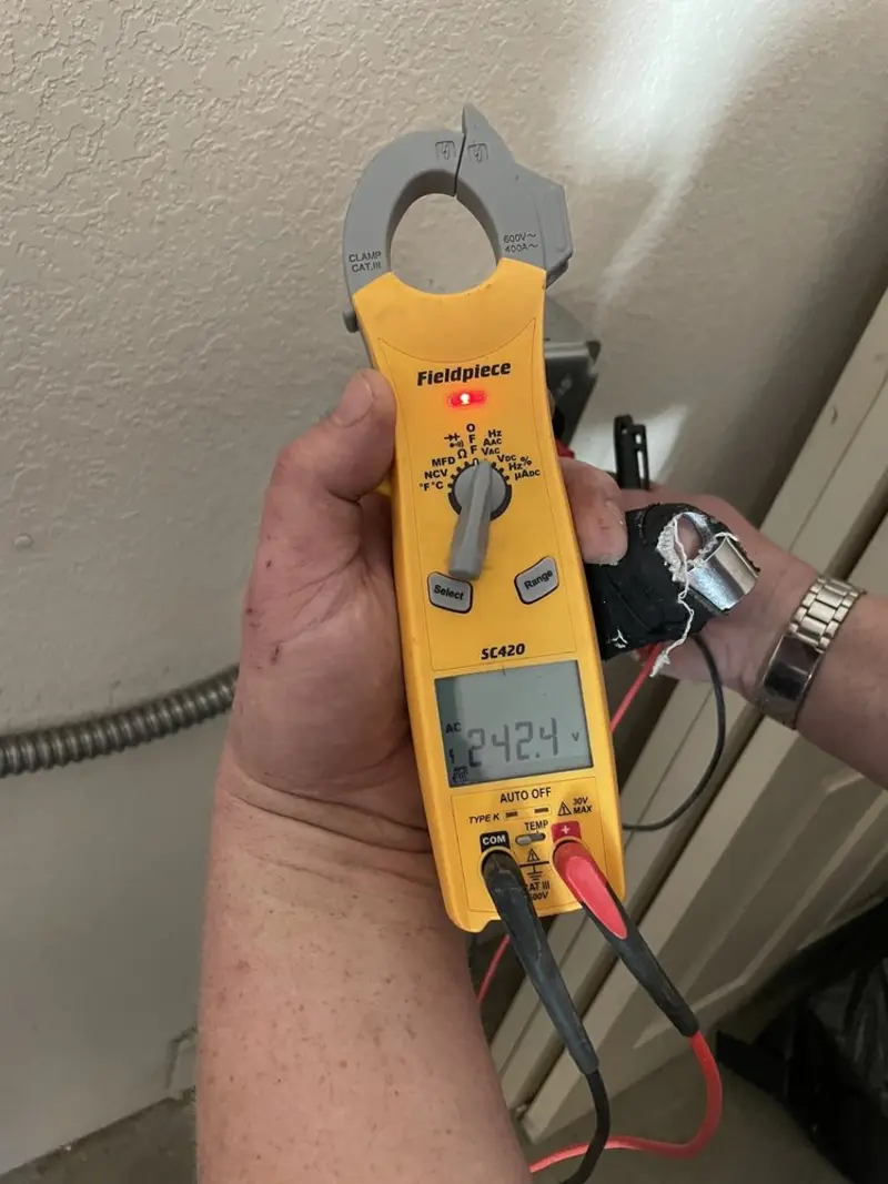 Voltage testing with clamp meter during Electrical Installation Services in Evergreen Park